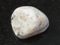 Polished baryte stone on dark background