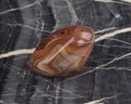 polished brown agate stone isolated on white