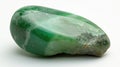 Polished Chrysoprase gem, showcasing its translucent green beauty, on a seamless white background.