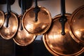 Hanging Copper Pots and Pans in a Kitchen Interior Royalty Free Stock Photo