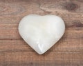 Polished cream white carved onyx heart