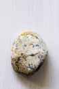 Polished dendrite opal gemstone on a white background Royalty Free Stock Photo