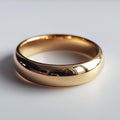 Polished gold wedding band with smooth reflective surface