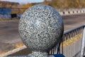 Polished granite ball as decoration element of a garden structure