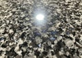 Polished granite surface featuring a mix of black, white, and gray Royalty Free Stock Photo
