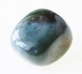 polished heliotrope (bloodstone) stone on white Royalty Free Stock Photo