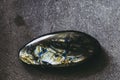 Polished labradorite gemstone on a black background Royalty Free Stock Photo