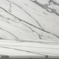 Polished marble surface featuring a smooth white backdrop interspersed with grey Royalty Free Stock Photo