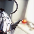 Polished metal kettle by the window Royalty Free Stock Photo