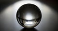 A polished metal sphere rests on Royalty Free Stock Photo