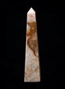 Polished multicolor carved onyx obelisk