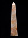 Polished multicolor carved onyx obelisk