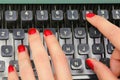 polished nails of Female secretary typing on the keys of an old typewriter in an office Royalty Free Stock Photo