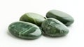 Polished nephrite jade stones on white background symbolizing mineral collection Royalty Free Stock Photo