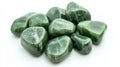 Polished nephrite jade stones on white background symbolizing mineral collection Royalty Free Stock Photo