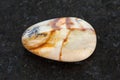 polished Picture jasper gemstone on dark Royalty Free Stock Photo