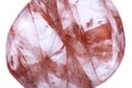 Polished quartz stone with red hematite inclusions Royalty Free Stock Photo