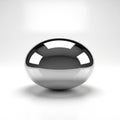 Polished, reflective metallic object with an oval shape placed on Royalty Free Stock Photo