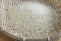 Polished rice in a bamboo basket Royalty Free Stock Photo