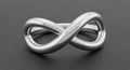 A polished, silver-metal sculpture shaped like an infinity symbol rests on a smooth, Royalty Free Stock Photo