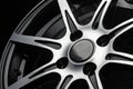 polished spokes of a car alloy wheel close-up on a black background