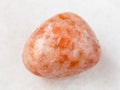 polished sunstone (heliolite) gem stone on white Royalty Free Stock Photo