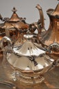 Polished and tarnished pieces of a silver tea set Royalty Free Stock Photo