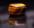 Polished tiger-eye stone Royalty Free Stock Photo