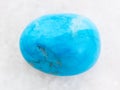 polished Turquenite (blue howlite) stone on white