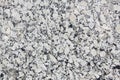 Polished white and grey granite surface. Mineral background. Con