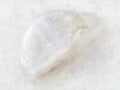 polished white moonstone (adularia) gem on white