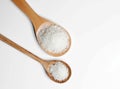 Polished white rice in wooden spoon