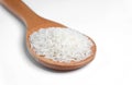 Polished white rice in wooden spoon