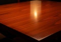 A polished wooden table surface with a rich, reddish-brown hue Royalty Free Stock Photo