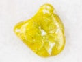 polished yellow Lizardite gemstone on white