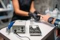 Polishing machine in nail salon, man manicure Royalty Free Stock Photo