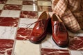 polishing shoes outdoors on sunny day