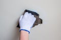 Polishing a wall with sandpaper closeup Royalty Free Stock Photo