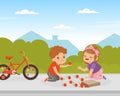 Polite little girl boy helping girl to pick up fallen apples from ground. Well mannered kid, good manners and respect