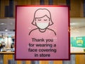 A polite window shop sign for face mask wearing.