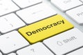 Political concept: Democracy on computer keyboard background Royalty Free Stock Photo