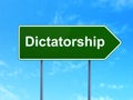 Political concept: Dictatorship on road sign background