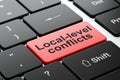 Political concept: Local-level Conflicts on computer keyboard background Royalty Free Stock Photo