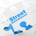 Political concept: Street Disturbances on puzzle background