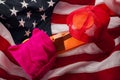 Political division and a divided country concept, illustrated by the pink hat representing the liberals and the red trucker hat Royalty Free Stock Photo