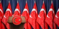 Political event, press conference or speach of a leader of Turkey. Flag of Turkey and speaker podium tribune