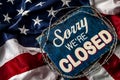 Political isolationism and economic slowdown in the United States of America concept with close up a sorry we`re closed sign