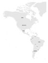 Political map of Americas in grey on white background. North and South America with country labels. Simple flat vector