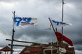 Political parties flags on local fishermen boat in Indonesia as part of political campaign that reach people in the villages Royalty Free Stock Photo