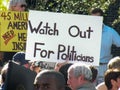 Political Rally with protest sign stating `Watch Out for Politicians`